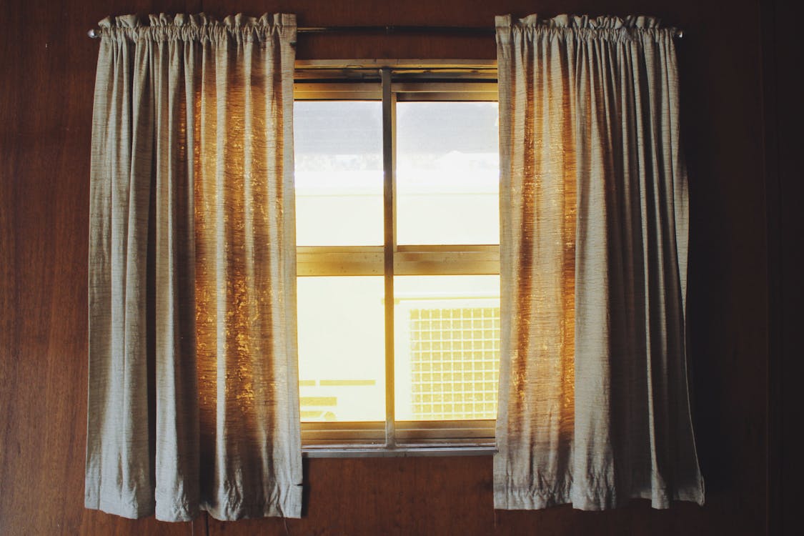 Window with sunlight and curtains